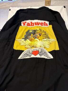 Yahweh Distressed Black Denim Jacket with Cherub Graphic